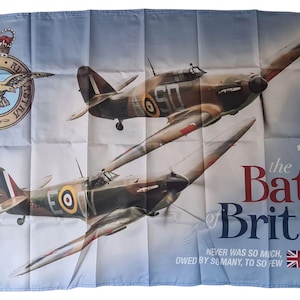 May include: A flag depicting two World War II fighter planes soaring in a light blue sky. The flag displays the text "the Battle of Britain 1940" and a Royal Air Force emblem. The flag also has the text "NEVER WAS SO MUCH, OWED BY SO MANY, TO SO FEW."