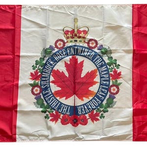 May include: A Canadian flag with red vertical panels on either side and a white central panel. The centre displays a red maple leaf encircled by a wreath and the words "THE THISTLE, SHAMROCK, ROSE ENTWINED, THE MAPLE LEAF FOREVER."