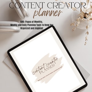 May include: A digital planner for content creators with a brown brushstroke design and the text "content creator planner" and "Master your content, track your progress, and elevate your brand".