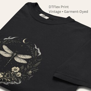 Close-up of Comfort Colors 1717 fabric texture and DTFlex print detail. Garment-dyed cotton with vintage softness. Dragonfly Sigil linework crisp and expressive. Symbolic, witchy, botanical design printed with high-detail durability.
