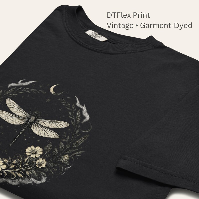 Close-up of Comfort Colors 1717 fabric texture and DTFlex print detail. Garment-dyed cotton with vintage softness. Dragonfly Sigil linework crisp and expressive. Symbolic, witchy, botanical design printed with high-detail durability.