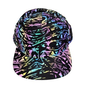 May include: Black baseball cap with a reflective, abstract design in shades of blue, green, yellow, and pink. The cap features a curved brim and a structured crown, suitable for casual wear.