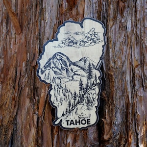 Lake Tahoe Sticker - Mountains, Forest and Clouds - Wood Grain Background - Hand Drawn