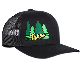 May include: Black trucker hat with a green and yellow embroidered design of pine trees and the word "Tahoe".