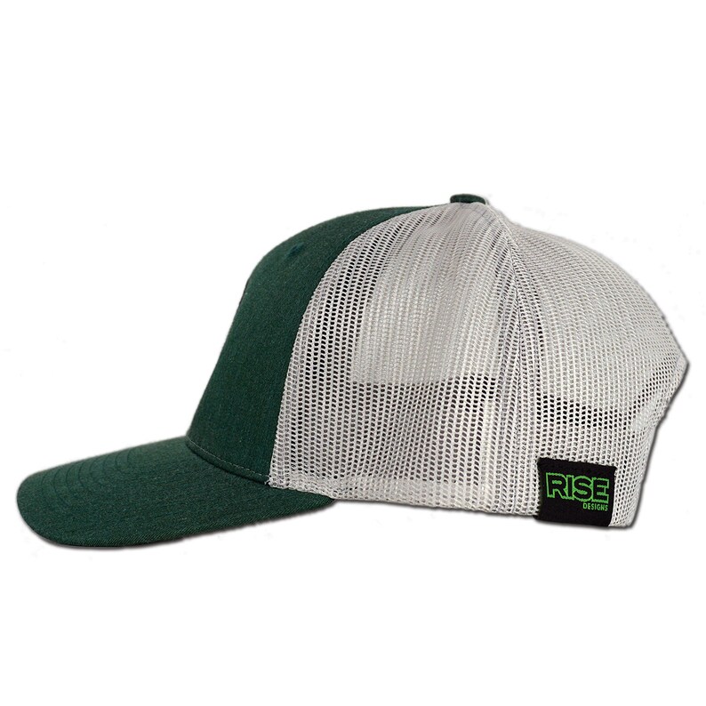 May include: A green and white trucker hat with a mesh back. The hat has a black label on the back that says "RISE DESIGNS".