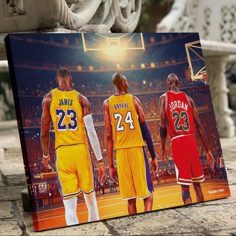 May include: A canvas print featuring three basketball players in their jerseys. LeBron James in a yellow jersey with the number 23, Kobe Bryant in a yellow jersey with the number 24, and Michael Jordan in a red jersey with the number 23.