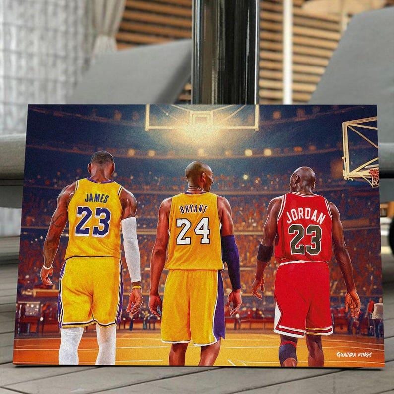 May include: A canvas print featuring three basketball players in their jerseys. LeBron James in a yellow jersey with the number 23, Kobe Bryant in a yellow jersey with the number 24, and Michael Jordan in a red jersey with the number 23.