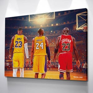 May include: A canvas print featuring three basketball players in their jerseys, viewed from the back. The players are wearing yellow, purple, and red uniforms with the numbers 23 and 24. The background shows a basketball court and an arena.