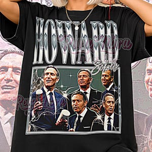 May include: Black unisex t-shirt featuring a graphic of Howard Schultz with the text "HOWARD" above and "Schultz" below. The graphic includes images of Howard Schultz. The words "Unisex Shirt" are at the bottom.