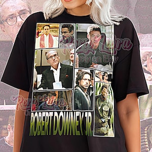 Könnte beinhalten: Schwarzes Unisex-T-Shirt mit einer Collage von Bildern von Robert Downey Jr. Das Shirt zeigt den Text "ROBERT DOWNEY JR." in Grün und Gelb. Die Worte "Unisex Shirt" sind ebenfalls sichtbar.
