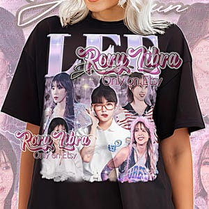 Puede incluir: Camiseta unisex negra con un diseño gráfico con el texto "Rory Libra Only on Etsy" e imágenes de varias personas. Las palabras "Unisex Shirt" están impresas en la parte inferior en rosa.