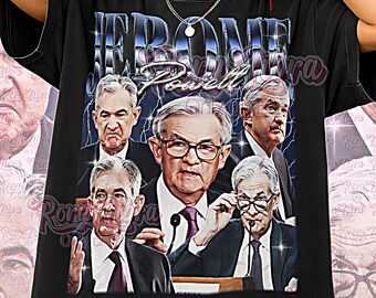 May include: Black unisex t-shirt featuring a graphic of Jerome Powell and the text "Jerome Powell". The design includes multiple images of Powell. The words "Unisex Shirt" are printed at the bottom of the shirt.