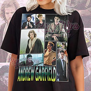 May include: Black unisex t-shirt featuring a collage of images of Andrew Garfield. The shirt has the text "ANDREW GARFIELD" in a gradient font. The words "Unisex Shirt" are printed at the bottom.