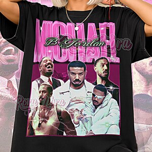 May include: Black unisex t-shirt with a graphic of Michael B. Jordan and the text "Michael B. Jordan Era". The design has a retro aesthetic with pink and green hues. The words "Unisex Shirt" are printed at the bottom.