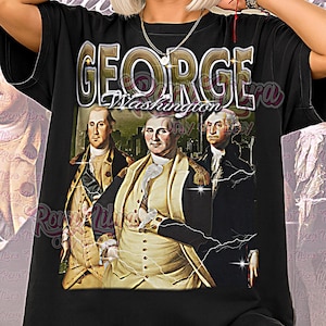 Könnte beinhalten: Schwarzes Unisex-T-Shirt mit einer Grafik von George Washington und dem Text "GEORGE Washington". Das Shirt hat ein Vintage-Design mit einem Porträt von George Washington und zwei anderen Männern. Die Worte "Unisex Shirt" sind unten aufgedruckt.