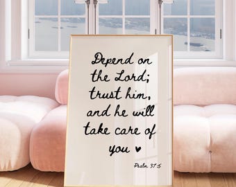 May include: A white framed print with a black inspirational quote that reads "Depend on the Lord; trust him, and he will take care of you." The quote is followed by "Psalm 37:5".
