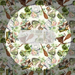 May include: A whimsical pattern featuring green frogs, books, cages, and potion bottles on a white background. The pattern is perfect for fabric, wallpaper, or wrapping paper.