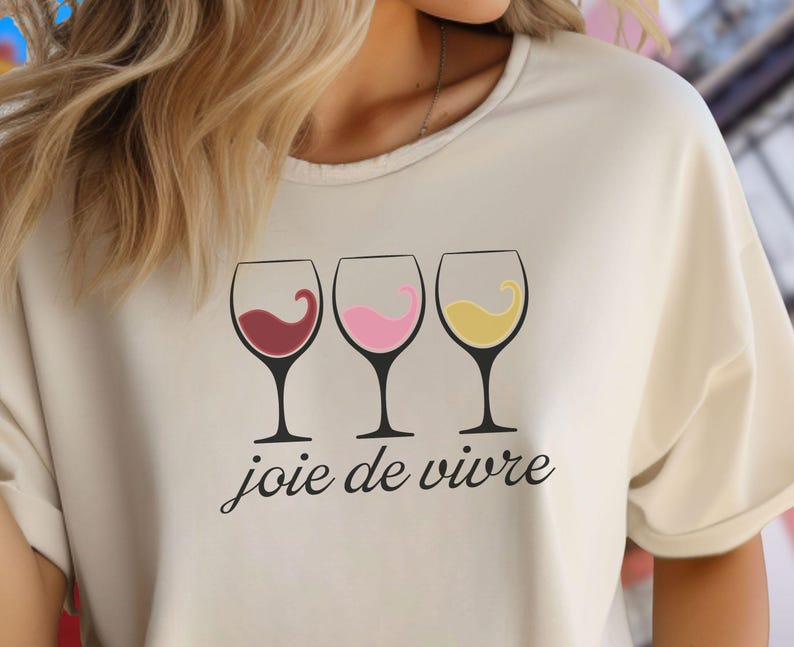 Bella Canvas 3001 wine shirt featuring three wine glasses filled with red, rosé, and white wine with the French phrase "joie de vivre," a perfect French-inspired graphic tee for wine lovers.