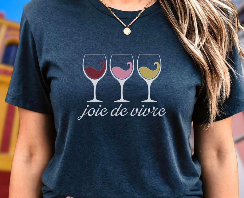 Bella Canvas 3001 wine shirt featuring three wine glasses filled with red, rosé, and white wine with the French phrase "joie de vivre," a perfect French-inspired graphic tee for wine lovers.