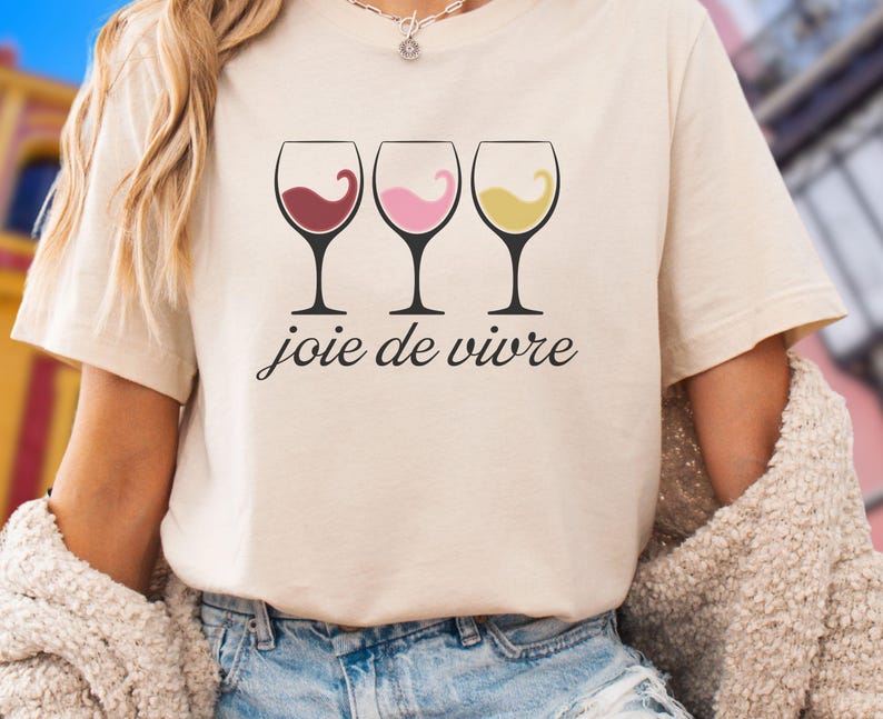 Bella Canvas 3001 wine shirt featuring three wine glasses filled with red, rosé, and white wine with the French phrase "joie de vivre," a perfect French-inspired graphic tee for wine lovers.