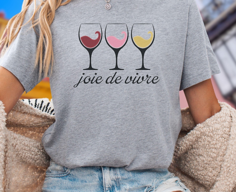 Bella Canvas 3001 wine shirt featuring three wine glasses filled with red, rosé, and white wine with the French phrase "joie de vivre," a perfect French-inspired graphic tee for wine lovers.