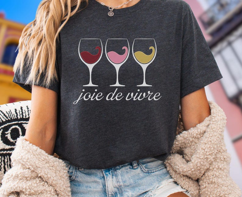 Bella Canvas 3001 wine shirt featuring three wine glasses filled with red, rosé, and white wine with the French phrase "joie de vivre," a perfect French-inspired graphic tee for wine lovers.