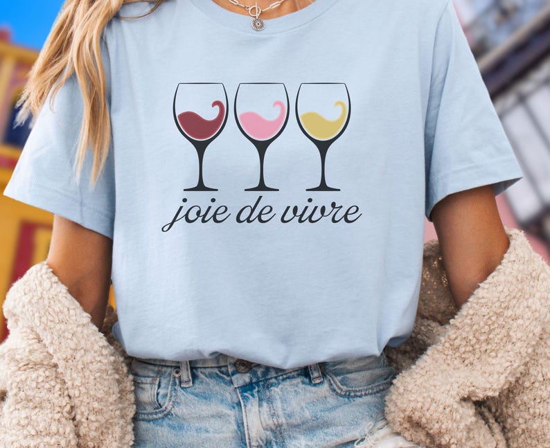 Bella Canvas 3001 wine shirt featuring three wine glasses filled with red, rosé, and white wine with the French phrase "joie de vivre," a perfect French-inspired graphic tee for wine lovers.