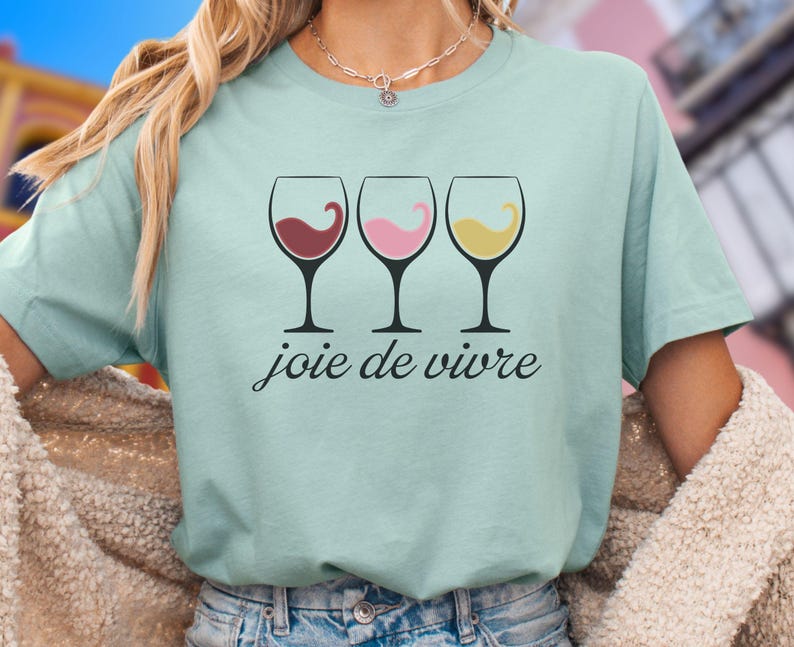 Bella Canvas 3001 wine shirt featuring three wine glasses filled with red, rosé, and white wine with the French phrase "joie de vivre," a perfect French-inspired graphic tee for wine lovers.