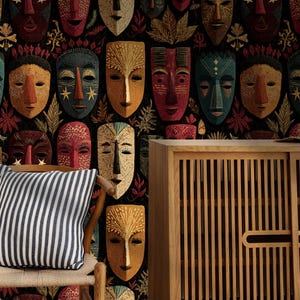 May include: A decorative wall featuring a repeating pattern of colorful tribal masks. A striped pillow rests on a wooden chair in front of the wall. A wooden cabinet with vertical slats is on the right.