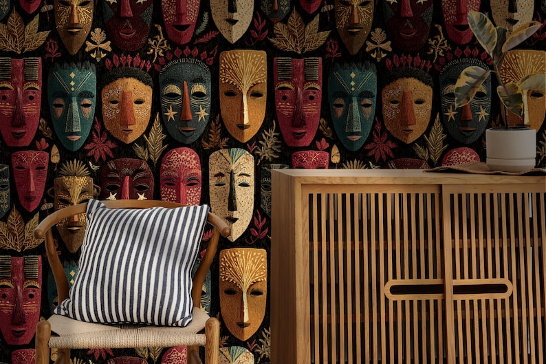 May include: A decorative wall featuring a repeating pattern of colorful tribal masks. A striped pillow rests on a wooden chair in front of the wall. A wooden cabinet with vertical slats is on the right.