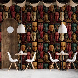 May include: Interior design featuring a wall covered in a repeating pattern of colorful tribal masks. The room includes white chairs, small tables, and hanging pendant lights. Wooden archways and a planter with cacti add to the decor.