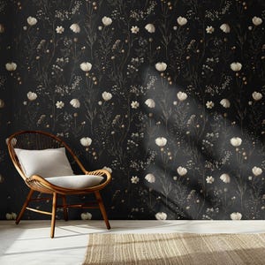 May include: A black and white floral wallpaper with a white chair and a brown ceramic vase in a room with a large window.