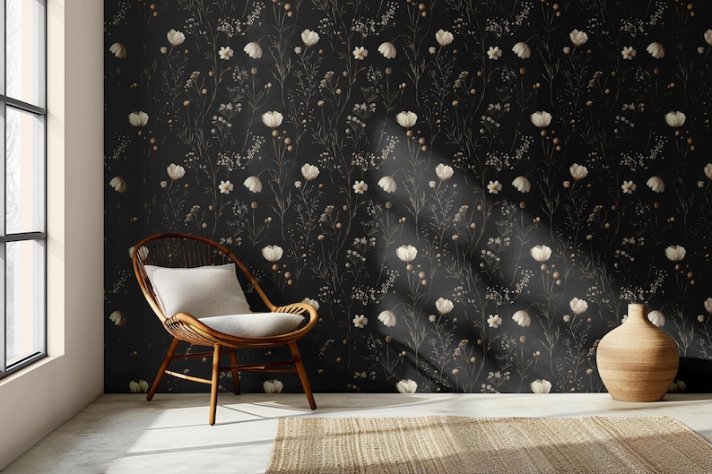May include: A black and white floral wallpaper with a white chair and a brown ceramic vase in a room with a large window.