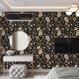 May include: A bedroom with floral wallpaper in black, beige, and cream tones. The room features a vanity with a round mirror, a tufted ottoman, and a flat-screen TV. A modern chandelier hangs from the ceiling.