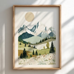 May include: A framed landscape art print featuring a mountain range, a sun, and a grassy foreground. The artwork uses a palette of greens, blues, and browns. The frame is made of light-colored wood. The art print is a landscape scene.