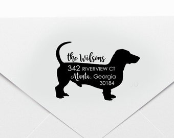 May include: White envelope with a black dachshund silhouette and address details. The text includes "the Wilsons", street address, city, state, and zip code. The design is simple and elegant.