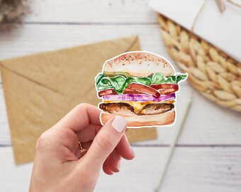 May include: Watercolor illustration of a hamburger with lettuce, tomato, onion, and cheese. The burger is on a white background.