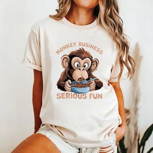 Monkey Business Serious Fun Shirt, Cute Cartoon Monkey Eating Cereal Graphic Tee, Funny Animal Lover T-Shirt, Playful Humor Casual Top
