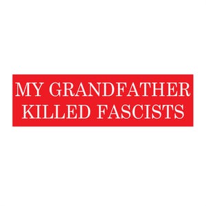 May include: A rectangular sticker with the text "MY GRANDFATHER KILLED FASCISTS" in white, set against a red background. The text is in a bold, sans-serif font.