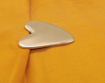Aureali Heart Kansa Gua sha for skin tightening and jawline