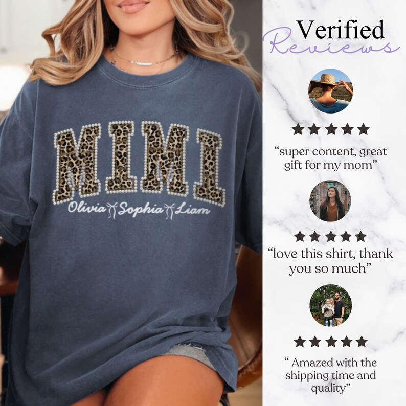 May include: A blue t-shirt featuring the word "MIMI" in a leopard print design, framed with white pearls. Underneath, the names "Olivia Sophia Liam" are written in white script. The shirt has a relaxed fit.