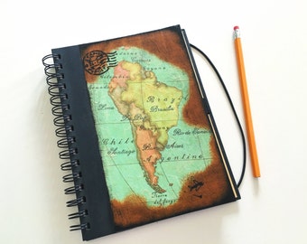 Travel journal with decoupage of South America's map