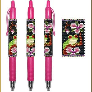 May include: Three pink pens with a beaded design featuring a green frog on a branch with pink flowers. The design is repeated on a separate beaded piece.