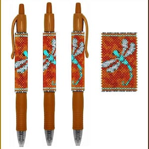 May include: Three brown pens with a beaded design featuring a dragonfly in shades of orange, turquoise, and white. The pens are shown against a white background.