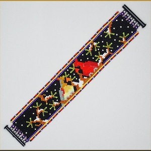May include: A beaded bracelet with a black background and colorful designs of birds and snowflakes. The bracelet is made with small beads and has a clasp closure.