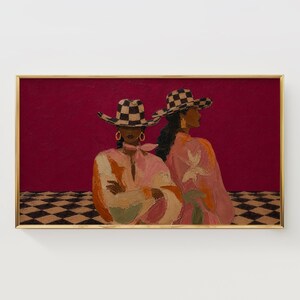 May include: A framed painting depicts two figures wearing black and white checkered cowboy hats against a deep magenta background. The figures wear pink and orange textured clothing, gold hoop earrings, and stand on a black and white checkered floor.