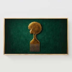 May include: A framed art print featuring a gold-colored afro pick with a profile of a woman's head and a textured afro. The background is a dark green color, and the frame is gold.