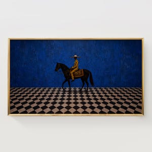 May include: A framed rectangular wall art print featuring a black horse with a rider wearing a yellow patterned outfit and a wide-brimmed hat. The scene is set against a solid blue wall and a floor with a black and white diamond checkerboard pattern.
