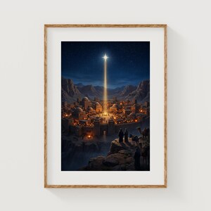 May include: A framed print showing a Middle Eastern town at night, lit by a bright star. The town has domed buildings and is set against mountains. Figures and camels are in the foreground, with a starry sky overhead.