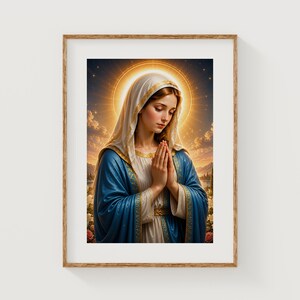 May include: A framed print featuring a religious image of a woman in a blue robe and white head covering, with a golden halo. The woman is depicted with her hands clasped in prayer, set against a backdrop of a sunset and a field of roses.